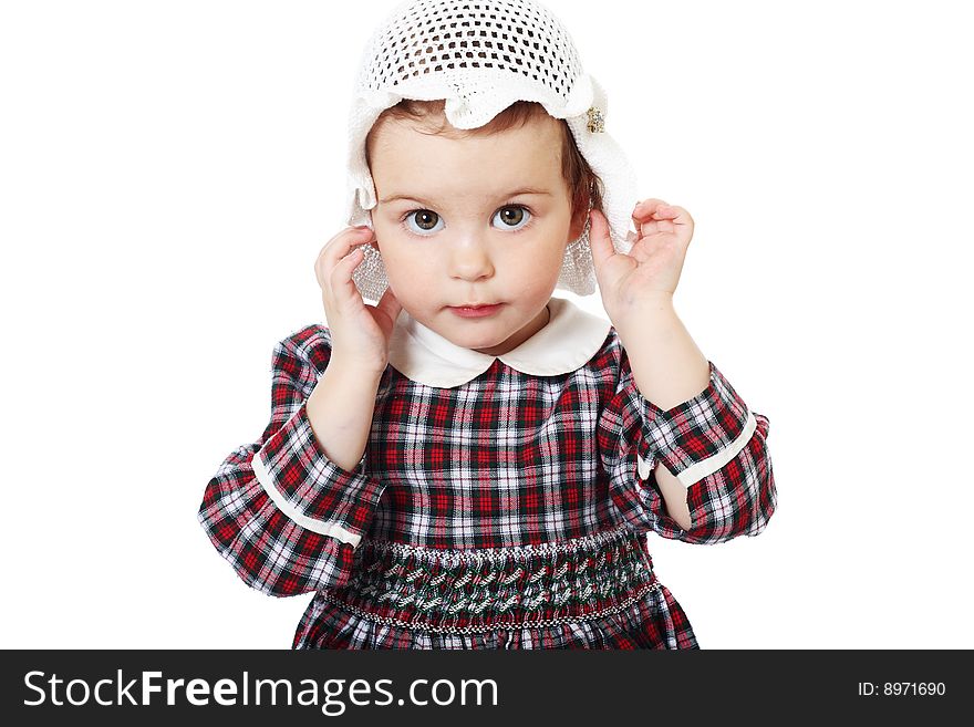 Little girl in checkered dress on white background