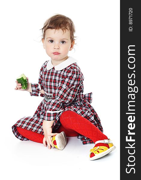 Little girl in checkered dress on white background