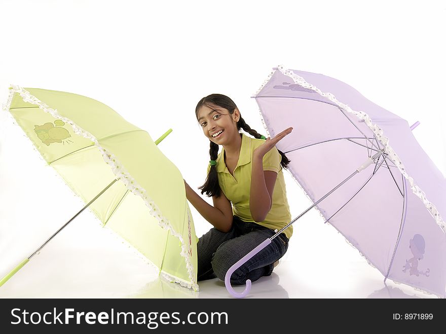 Girl sitting with two umbrella