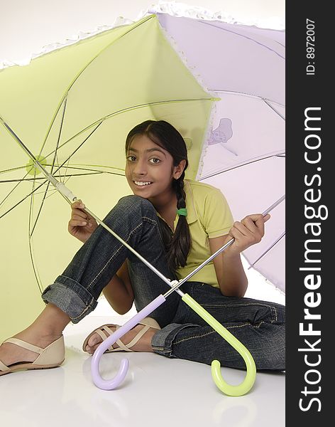 Girl Sitting With Two Umbrella