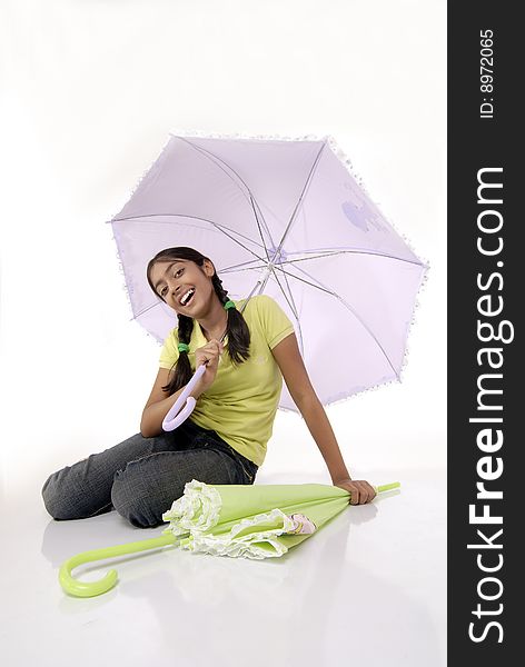 Girl sitting with two umbrella. Girl sitting with two umbrella