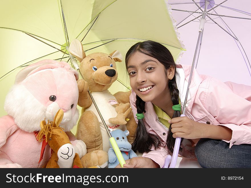Beautiful girl giving protection to toy family. Beautiful girl giving protection to toy family
