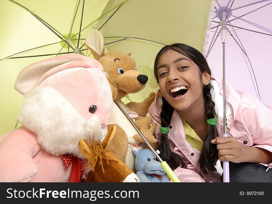 Beautiful girl giving protection to toy family. Beautiful girl giving protection to toy family