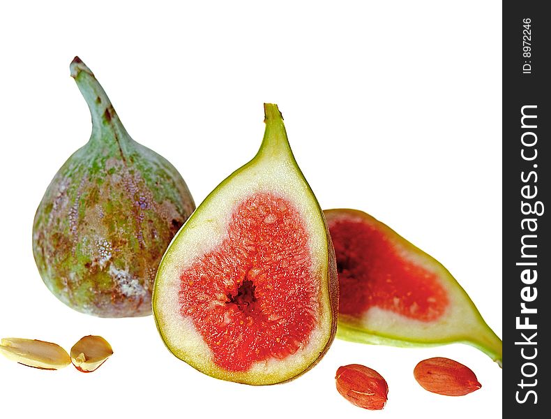 Ripe fresh sliced figs on isolated white background selective focus. Ripe fresh sliced figs on isolated white background selective focus