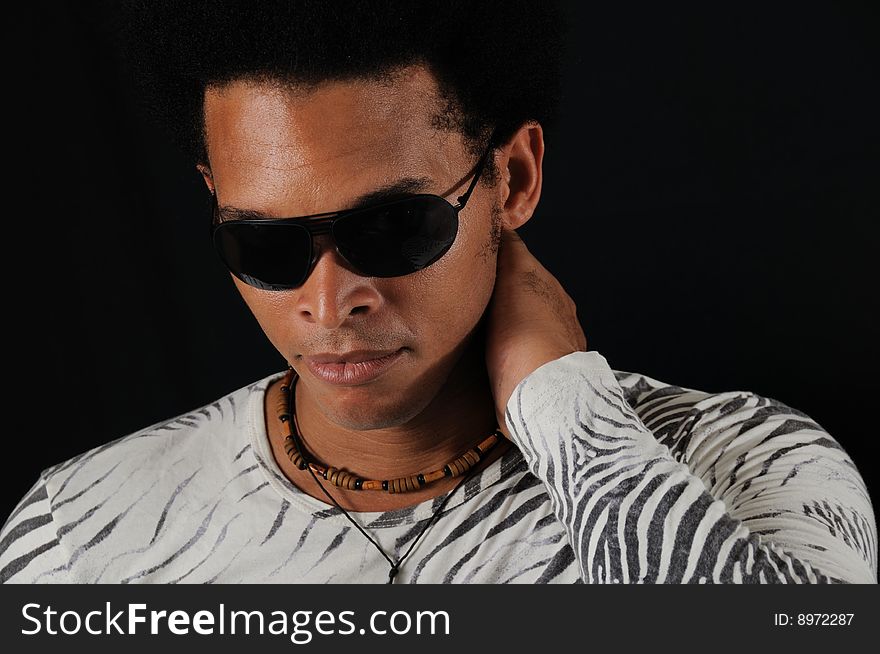Portrait of young trendy african american man wearing sunglasses. Portrait of young trendy african american man wearing sunglasses