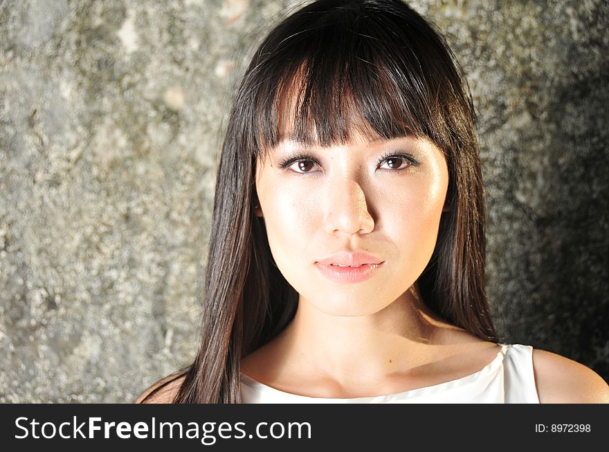 Beautiful modern Asian woman face.