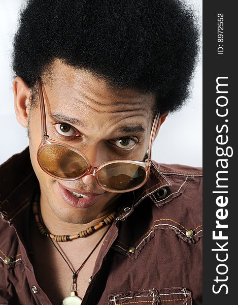 Portrait of young trendy african man with retro sunglasses. Portrait of young trendy african man with retro sunglasses