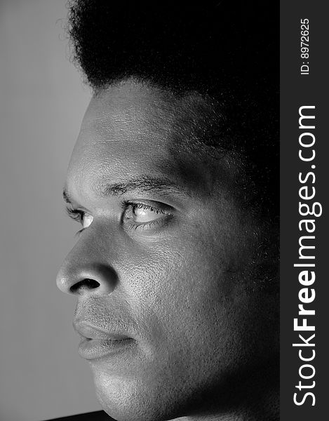 Profile portrait of young african american man in black and white. Profile portrait of young african american man in black and white