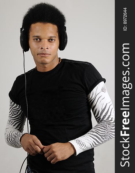 Portrait of young handsome african male model with headphones