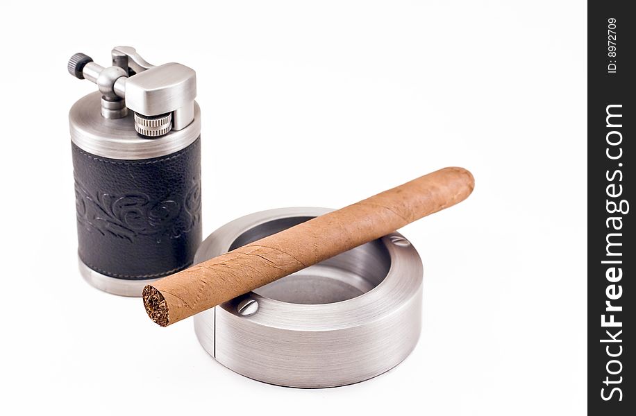 Stylish elegant metallic ashtray, lighter and cuban cigar. Stylish elegant metallic ashtray, lighter and cuban cigar