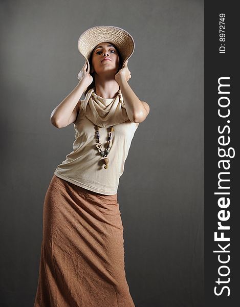 Portrait of beautiful and elegant young lady wearing a hat. Portrait of beautiful and elegant young lady wearing a hat