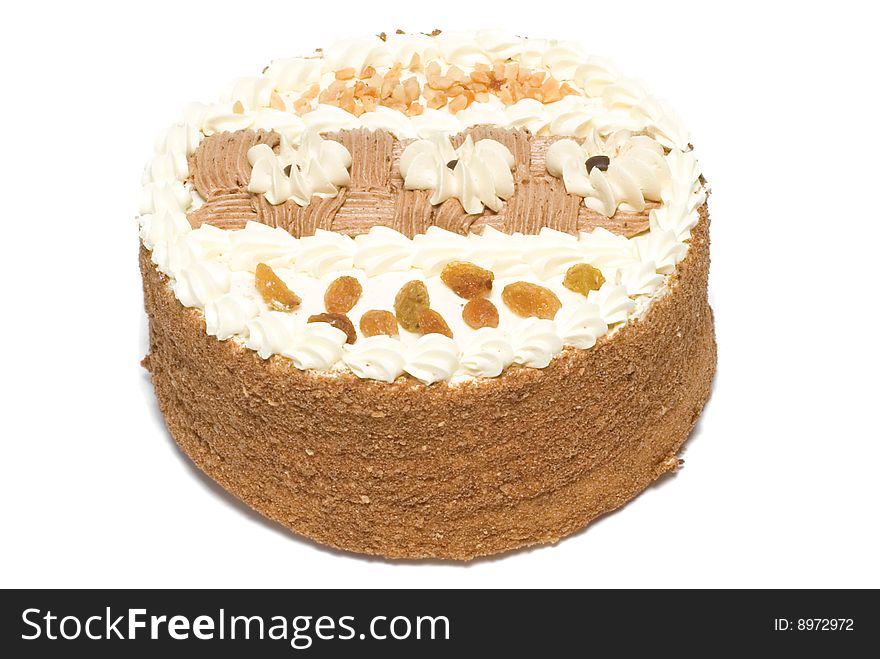 Cake is with cream, raisin and peanut. Cake is with cream, raisin and peanut