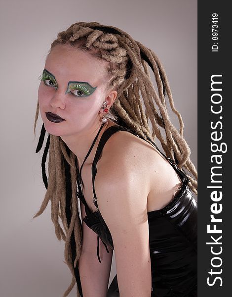 Young woman with dread locks and punk clothing. Young woman with dread locks and punk clothing