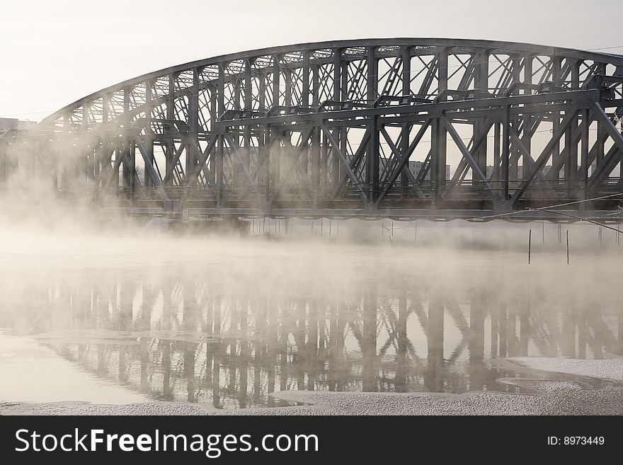 Very cold day, view over a river and bridge