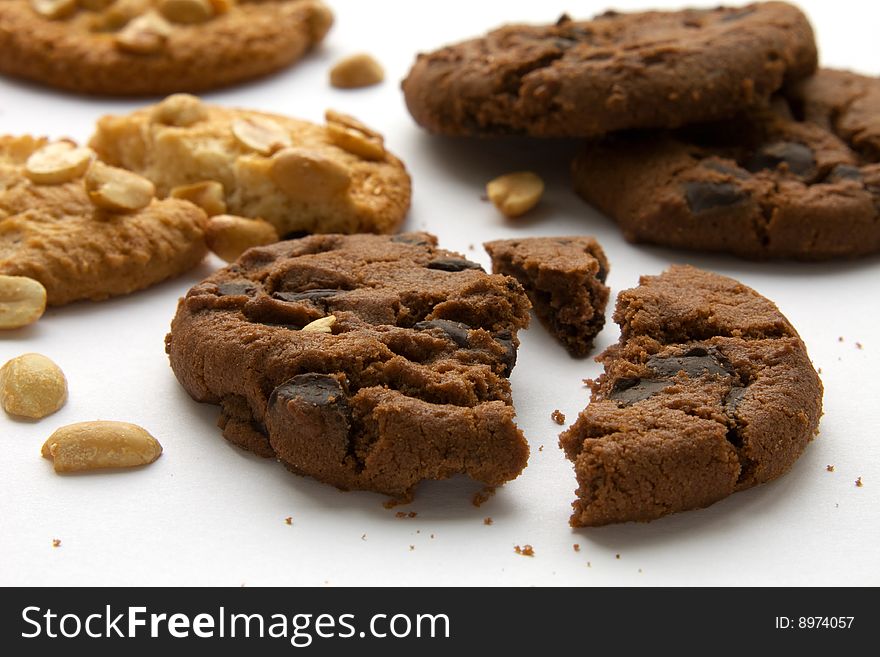 Pieces of cookies with chocolate and peanuts. Pieces of cookies with chocolate and peanuts