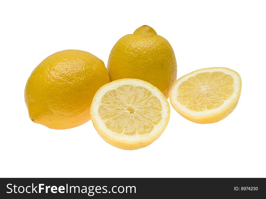 Three lemons one of which is divided in half