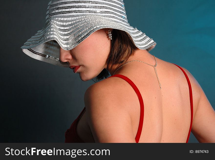 Portrait of young beauty posing with feminine hat. Portrait of young beauty posing with feminine hat