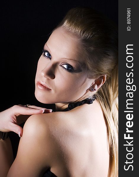 Closeup of Beautiful blond girl on a black background. Closeup of Beautiful blond girl on a black background