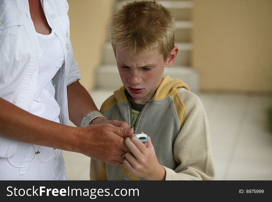 Woman and boy with a mobile phone