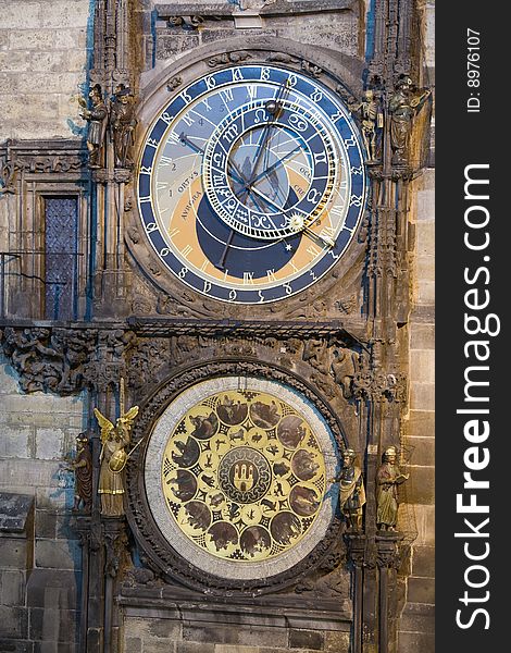 Unique astronomical clock on gothic Old Town Hall in Prague supplemented with a round calendarium including zodiac signs painted by Josef Manes (1865). View at night lighting.