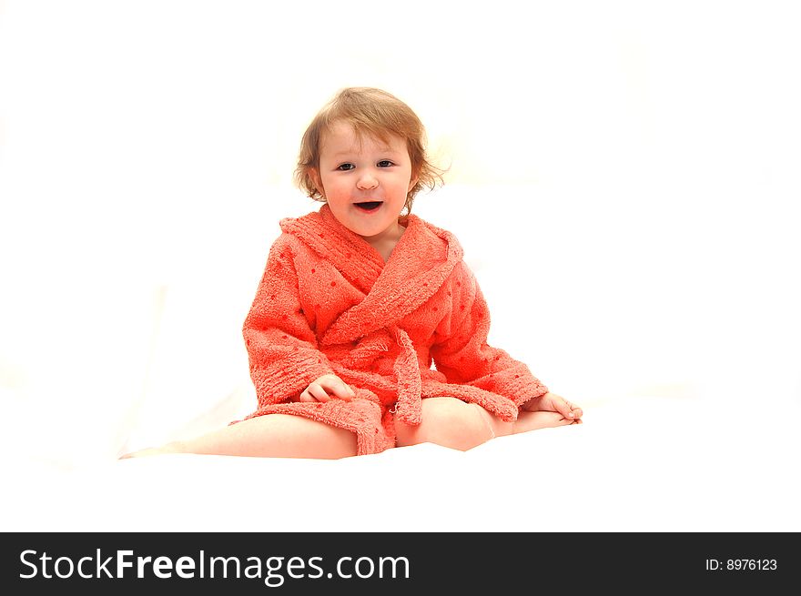 Portrait of the little girl in a dressing gown