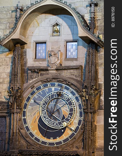 Unique astronomical clock on gothic Old Town Hall in Prague supplemented with a round calendarium including zodiac signs painted by Josef Manes (1865). View at night lighting.