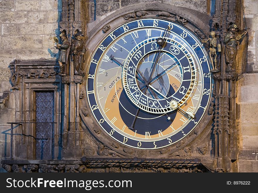 Unique astronomical clock on gothic Old Town Hall in Prague supplemented with a round calendarium including zodiac signs painted by Josef Manes (1865). View at night lighting.