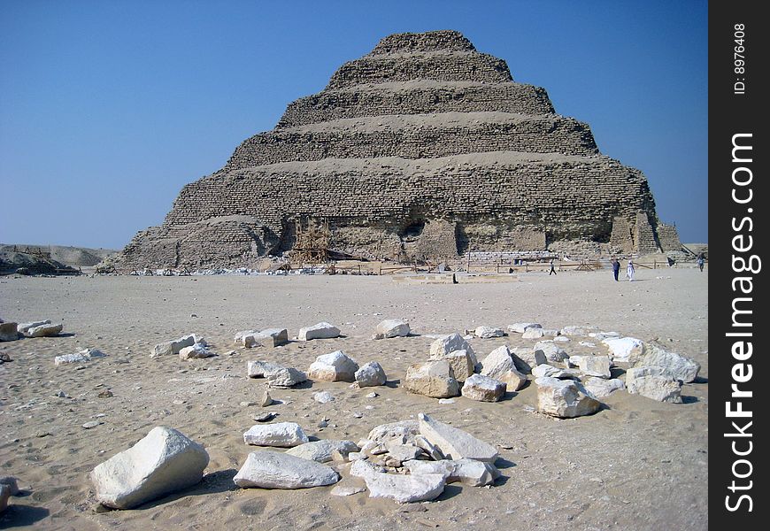 Step pyramid of zooser in Egypt agains the blue sky