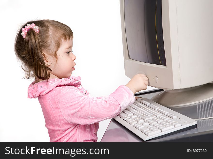 Little girl playing with desktop computer. Little girl playing with desktop computer