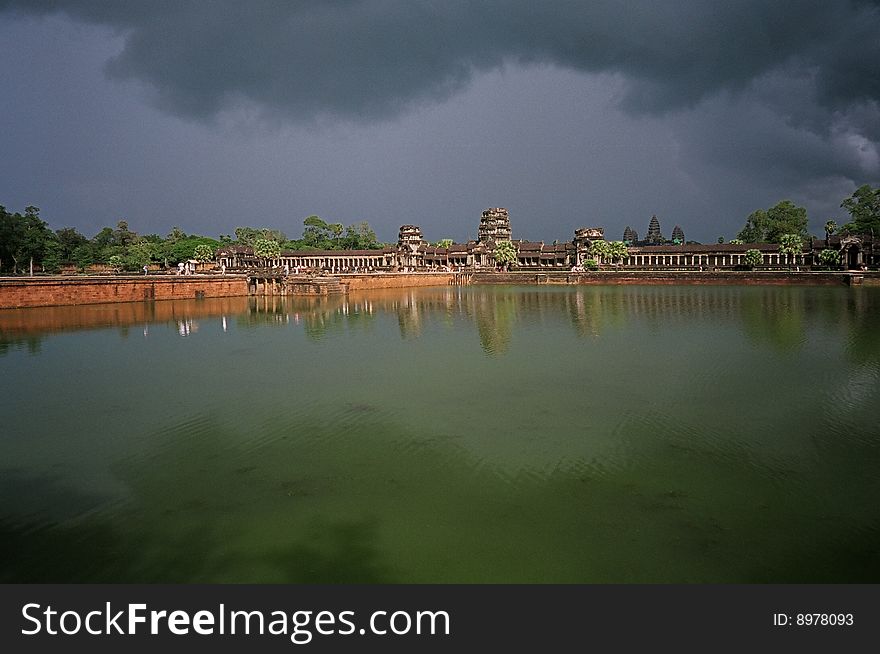 The Angkor wat and its pool after a storm. The Angkor wat and its pool after a storm