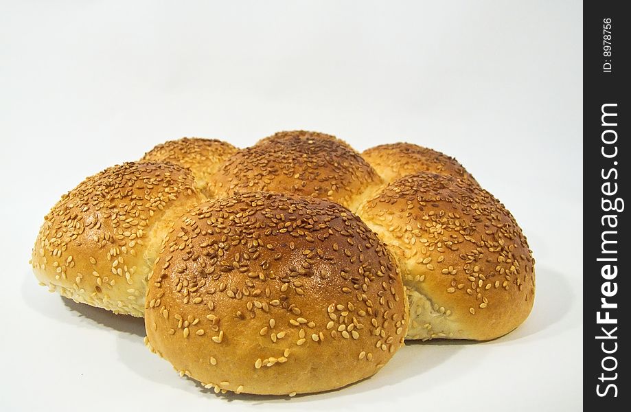 Bread with sesame on top shot on white background