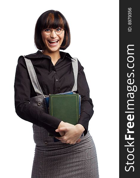 Laughing brunette schoolgirl hold books in the hands over white background