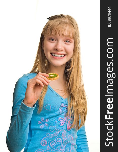 Young blonde girl with biscuit in hand. Young blonde girl with biscuit in hand