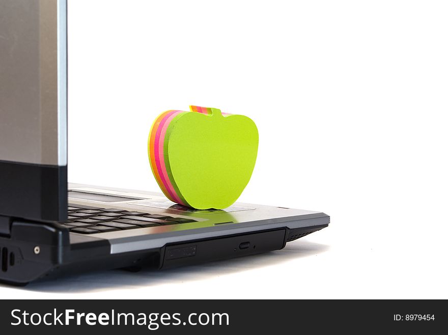 Notebook and coloured apple from a paper