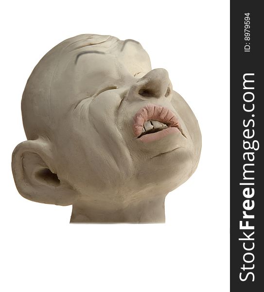 A  plasticine (modeling clay) model of a man's face with painful grimace