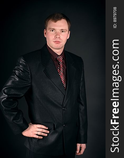 Young man on a black background