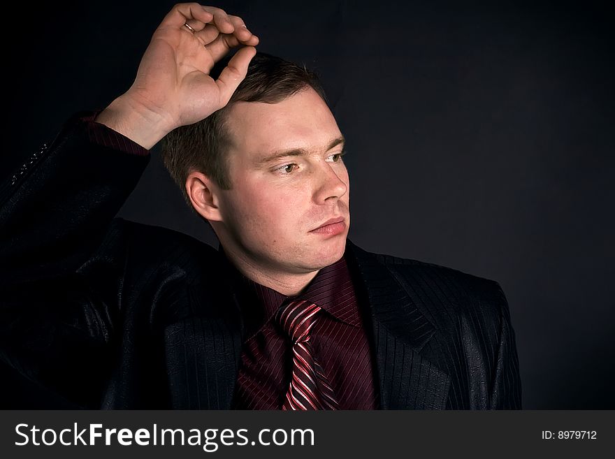 Young man on a black background