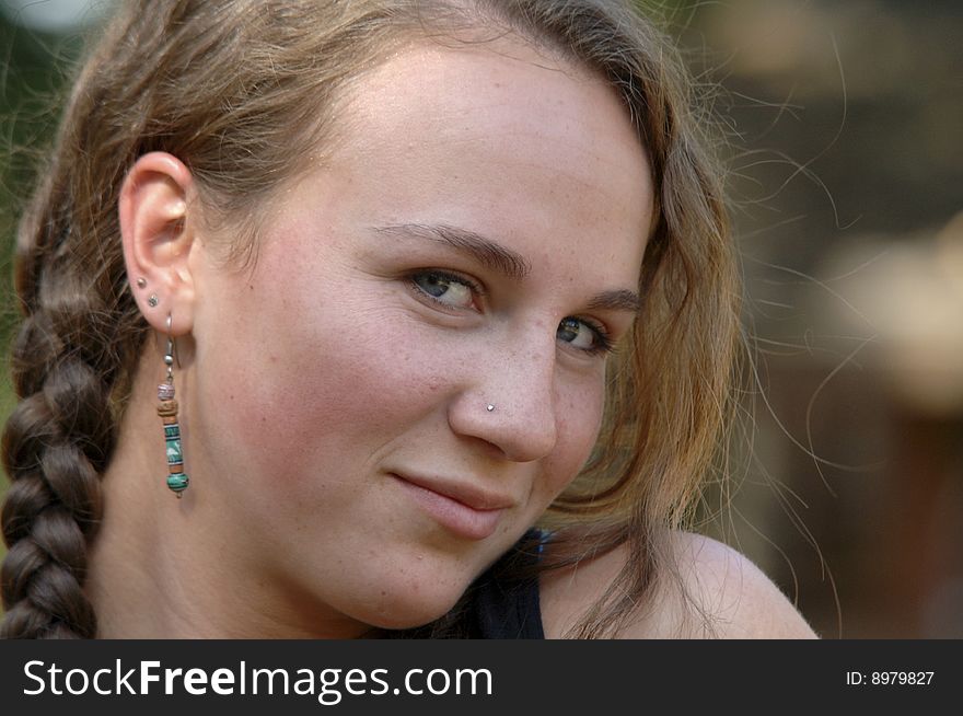 Outdoor portrait of a pretty teenage girl with braids. Outdoor portrait of a pretty teenage girl with braids.