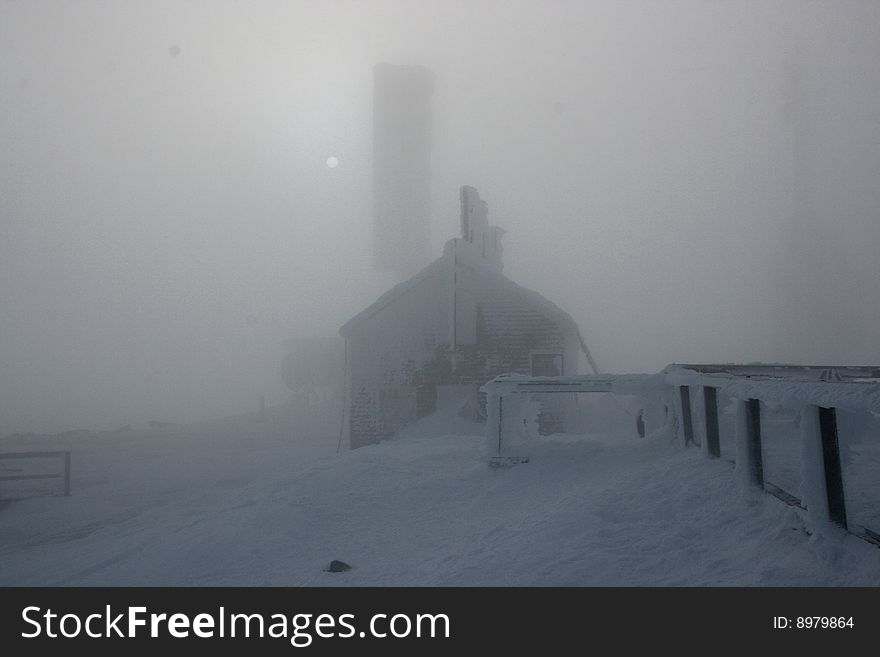 Rime ice covered stage office in fog
