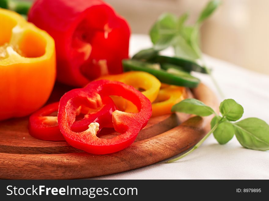 Red and yellow peppers with fresh basil