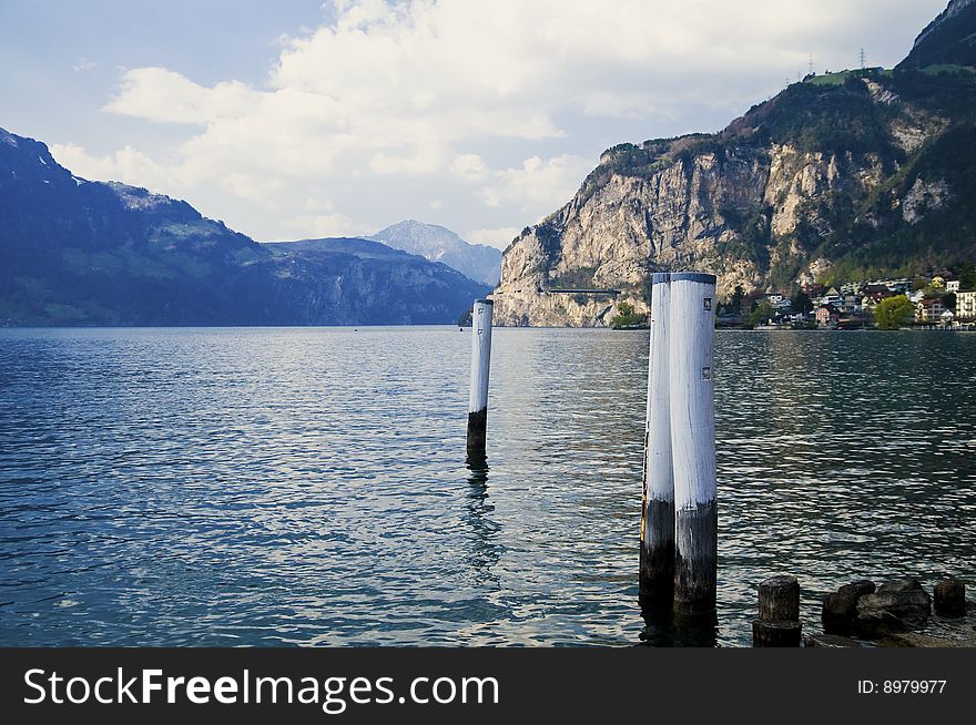 Scenic view of lake Lucerne with Alps mountains in background under cloudscape, Switzerland. Scenic view of lake Lucerne with Alps mountains in background under cloudscape, Switzerland.