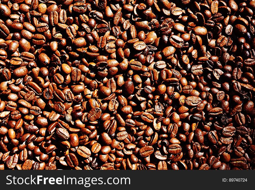 A background of roasted coffee beans.