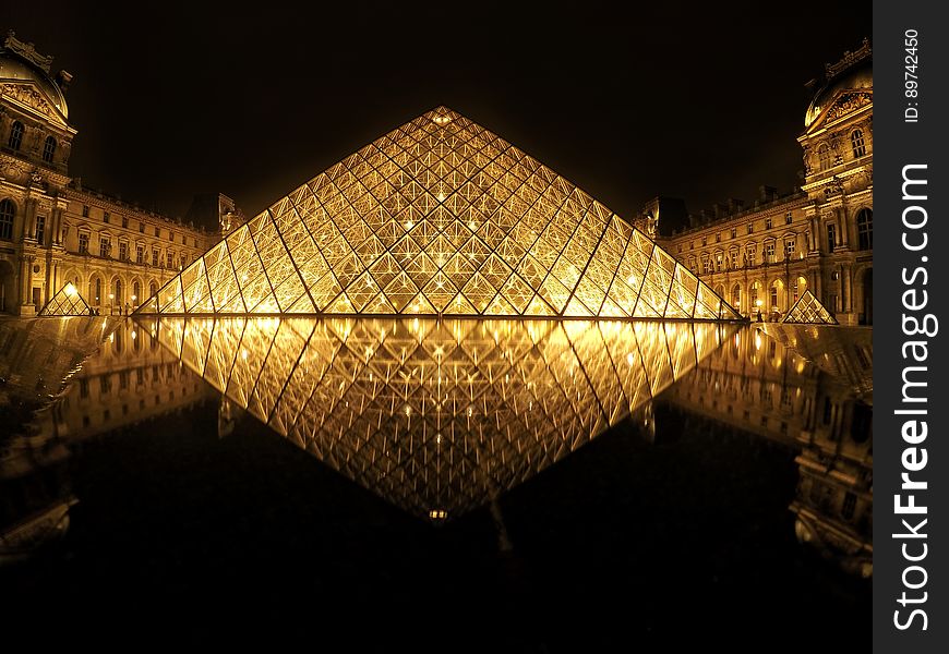 The Louvre pyramid n the main courtyard (Cour NapolÃ©on) of the Louvre Palace (Palais du Louvre) in Paris.