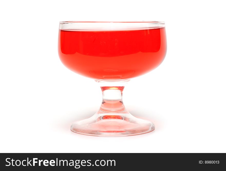 Red jelly in transparent glass, transparent, on white background. Red jelly in transparent glass, transparent, on white background