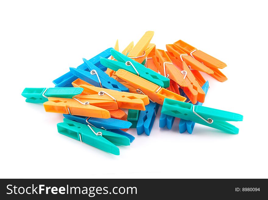 Many clothespins over white background