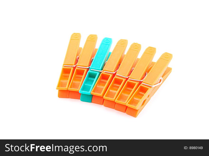 Many clothespins over white background