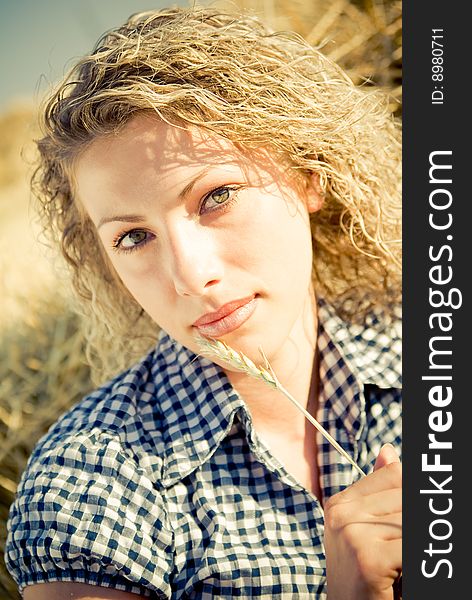 Beautiful country girl lying on the haystack. Beautiful country girl lying on the haystack