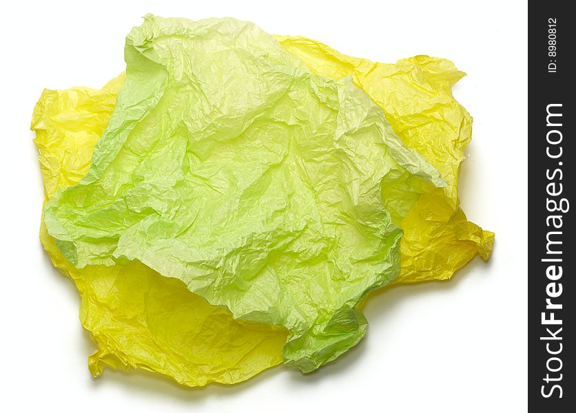 Yellow and green crumpled paper isolated on white. Yellow and green crumpled paper isolated on white