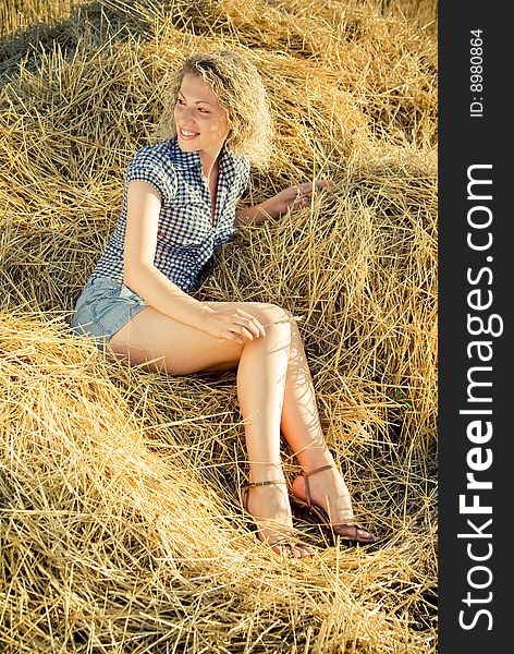 Beautiful Girl Lying On The Haystack