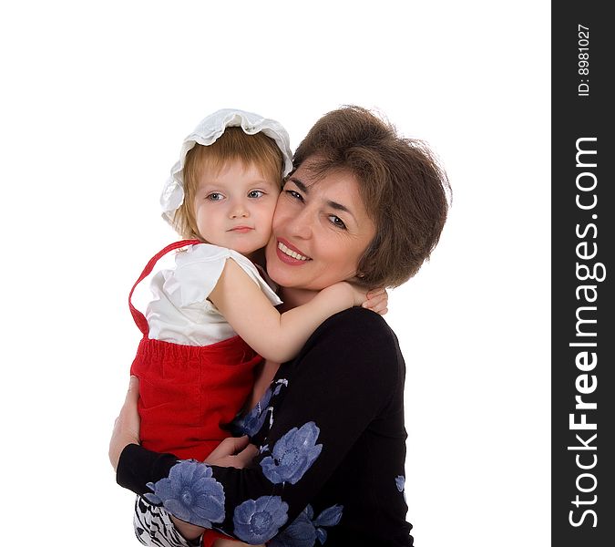 Grandmother hold her small daughter. Studio isolated